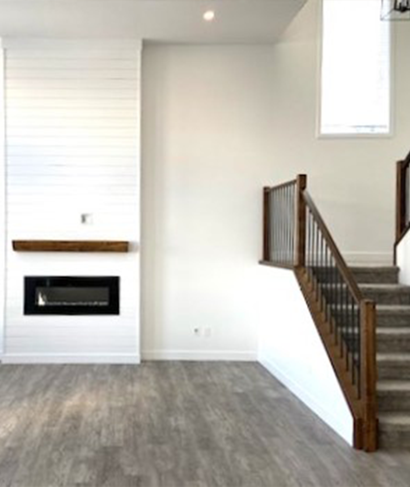 Mat Ward Construction | New 2 story living room with inset fireplace